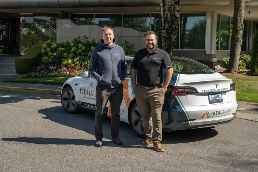 Alex Filipuk (on the left) with one of Ideal Siding Franchisees